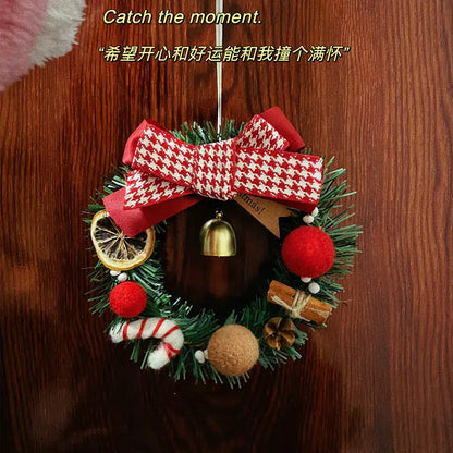 Christmas Gift Decorative Wreath for Home Decor hanging on a door with festive decorations including a bow and ornaments.